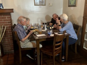 table with people sitting and talking